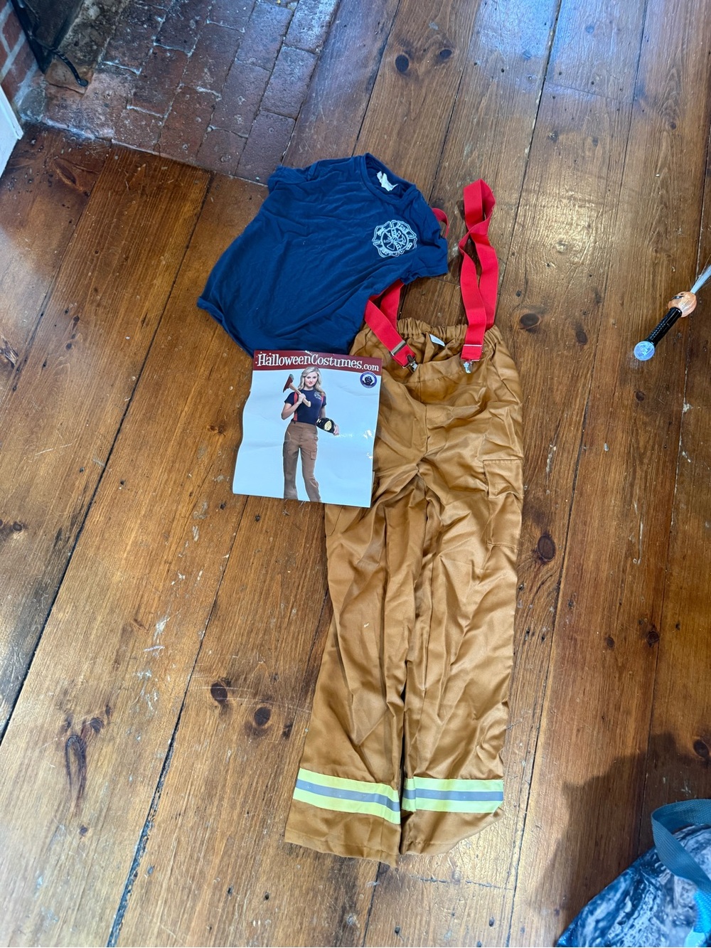 Firefighter Costume with Red Suspenders and Tan Pants